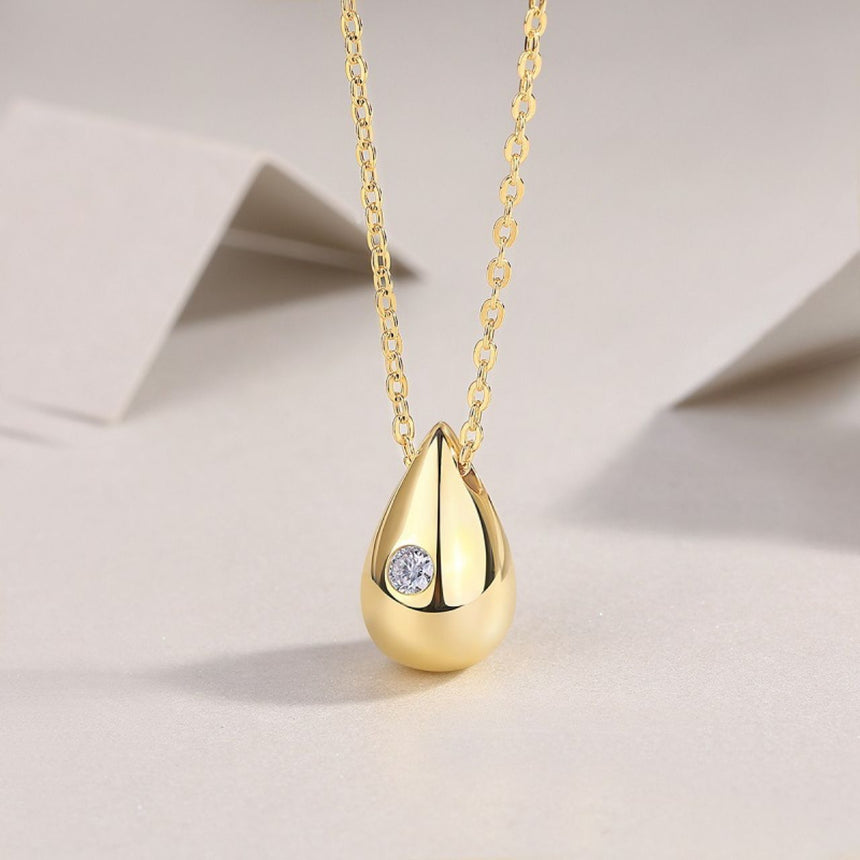 Golden Dawn: Luminous Moissanite Vermeil Teardrop Pendant