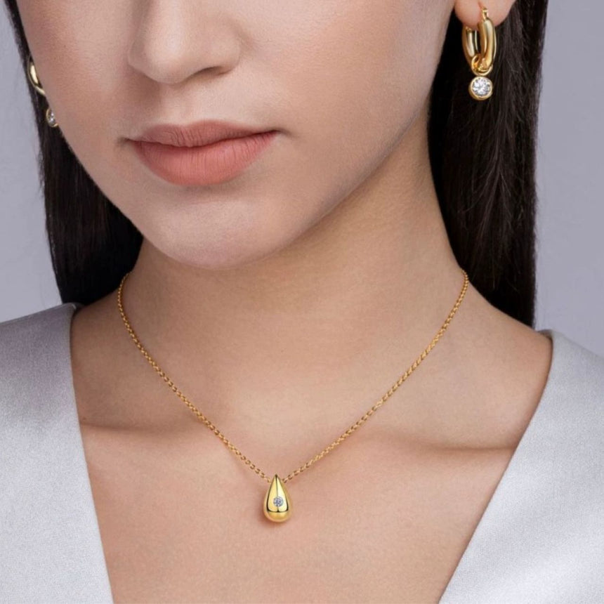Golden Dawn: Luminous Moissanite Vermeil Teardrop Pendant