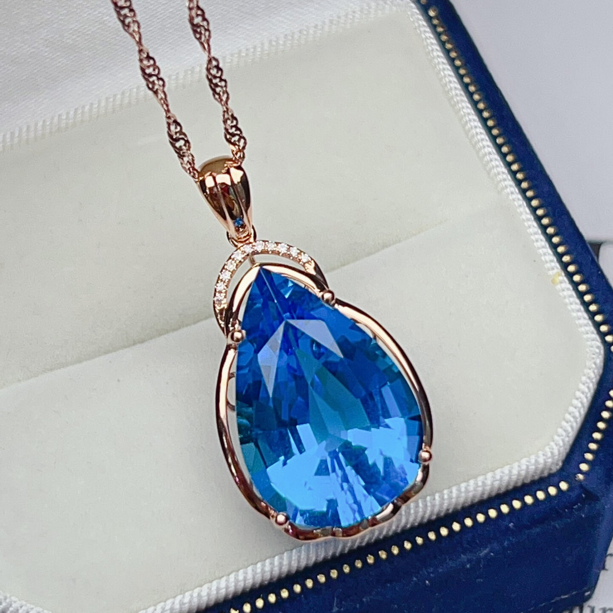 Pear Cut Swiss Blue Topaz Pendant in Rose Gold