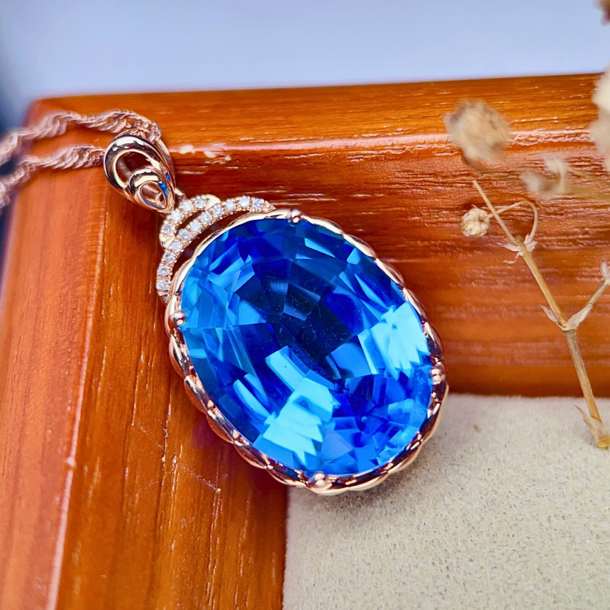 Oval Blue Topaz Pendant Necklace in 18K Rose Gold