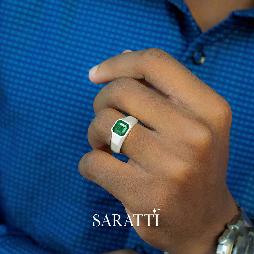 Mens emerald wedding ring worn on hand in platinum | SARATTI