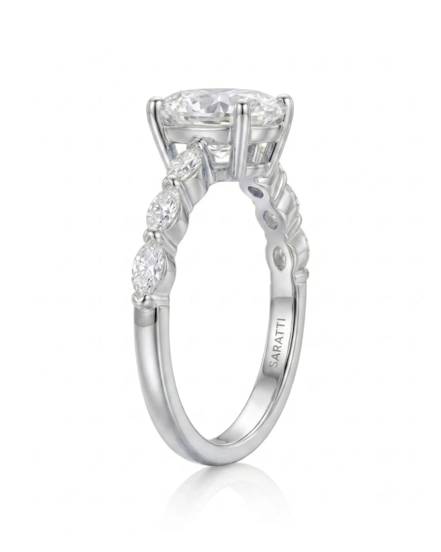 Elegant oval moissanite proposal ring with symmetrical marquise shoulders crafted in 18K white gold -- SARATTI