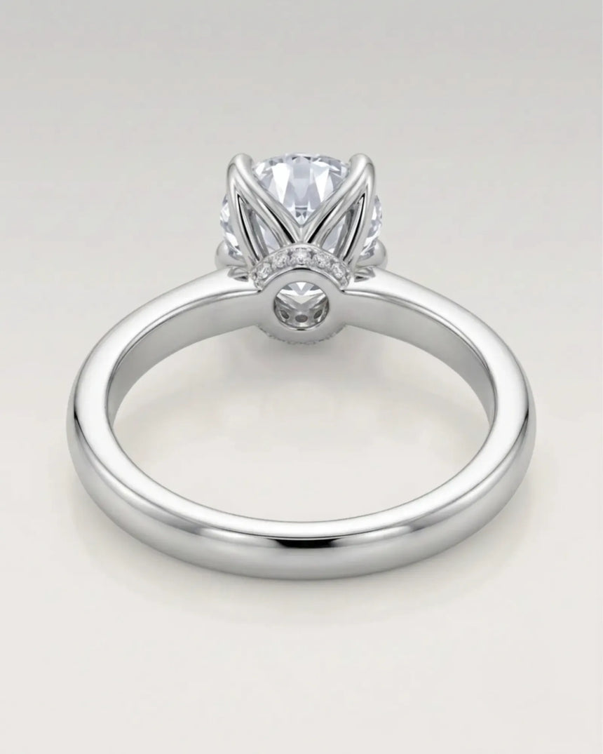 Minimal round moissanite ring with sculptural floral setting and polished 18K White gold band | SARATTI