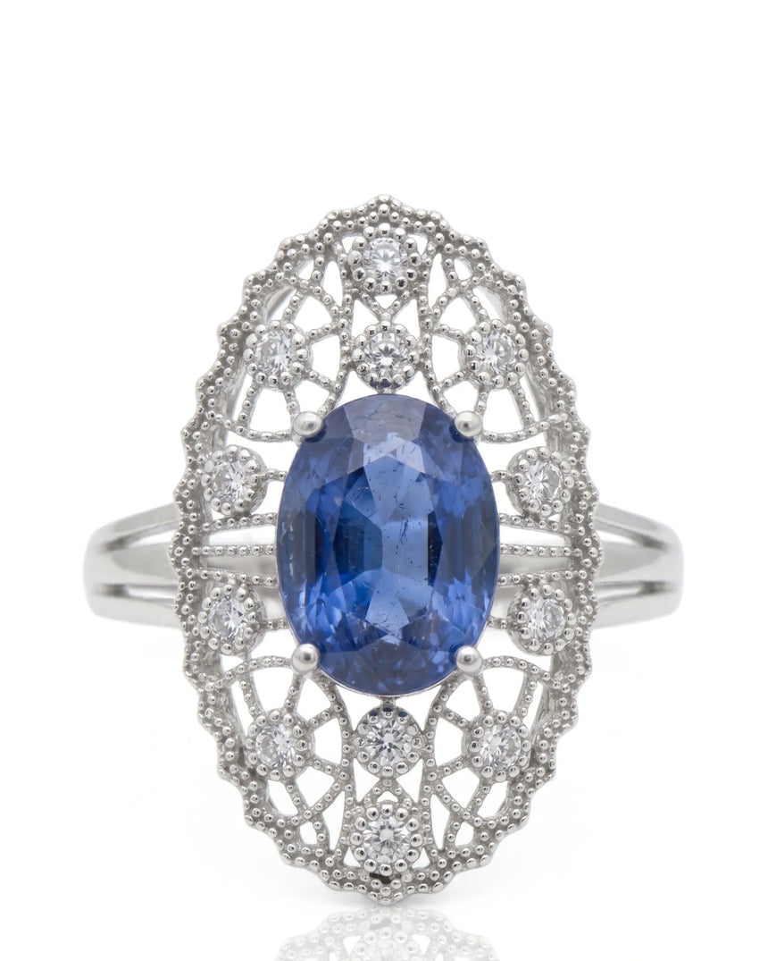 Antique-inspired sapphire ring with openwork diamond halo in polished platinum | SARATTI
