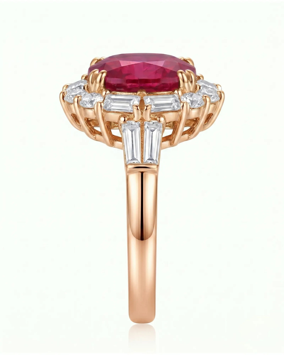 Architectural ruby ring with round, baguette, and emerald-cut diamonds in rose gold | SARATTI