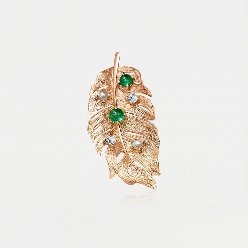 Antique-inspired gold plume brooch with green emeralds | SARATTI