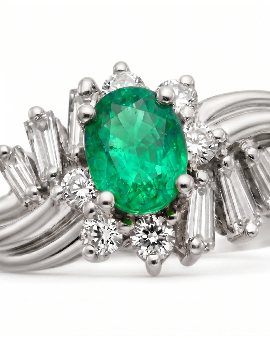 Oval cut natural emerald ring with round and baguette diamonds in platinum | SARATTI