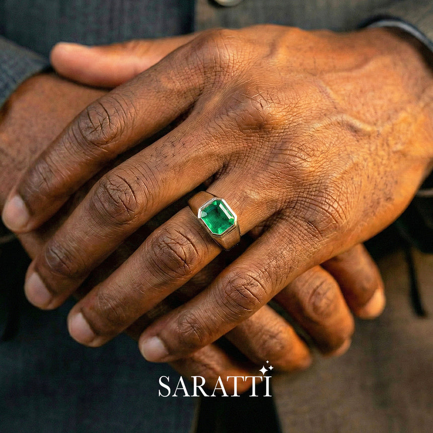 Mens emerald wedding ring emerald cut center stone detail in platinum | SARATTI