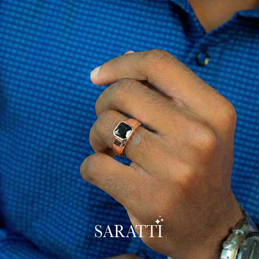 Matte black mens wedding band worn on hand in 18K rose gold | SARATTI