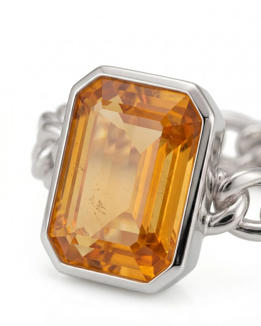 Bezel set orange sapphire ring with modern chain link design in 18K white gold | SARATTI