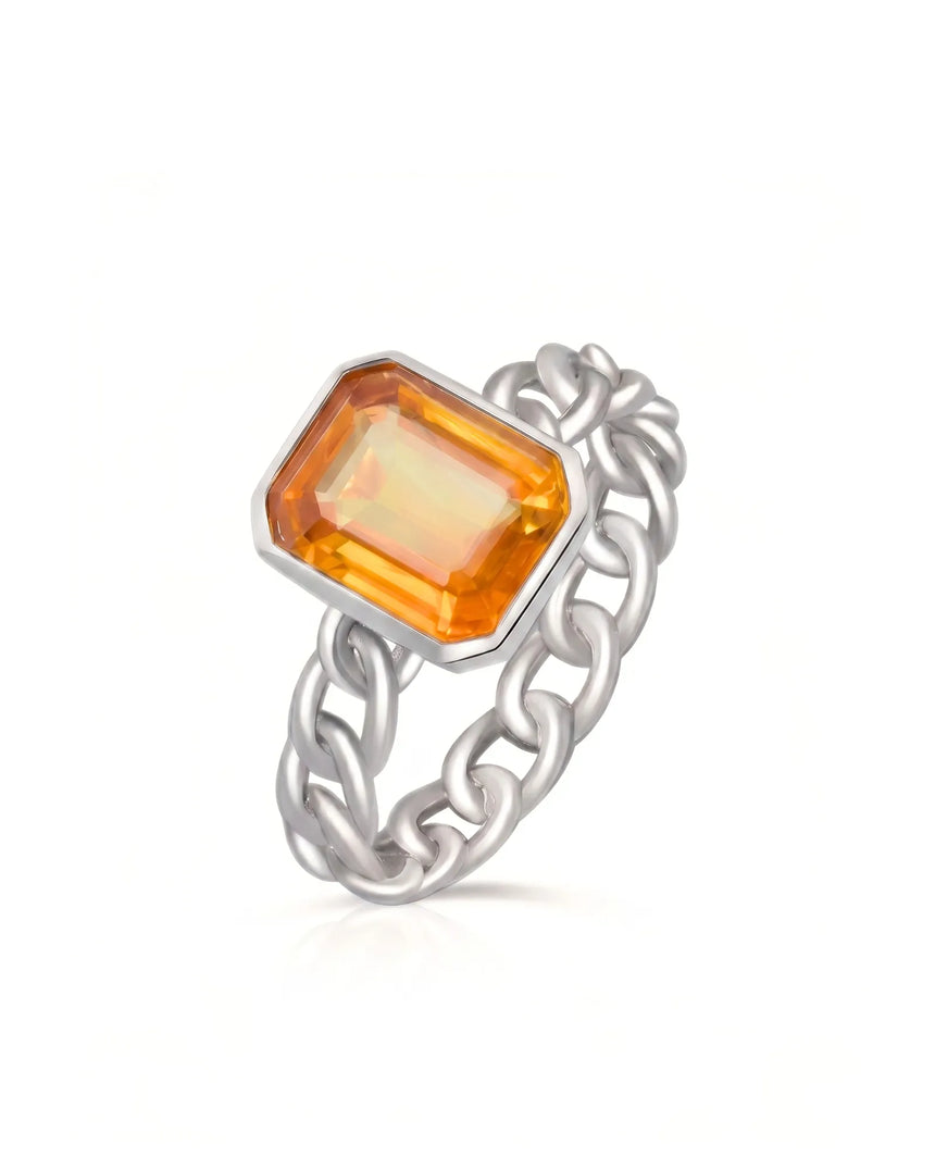 Bezel set orange sapphire ring with modern chain link design in platinum | SARATTI