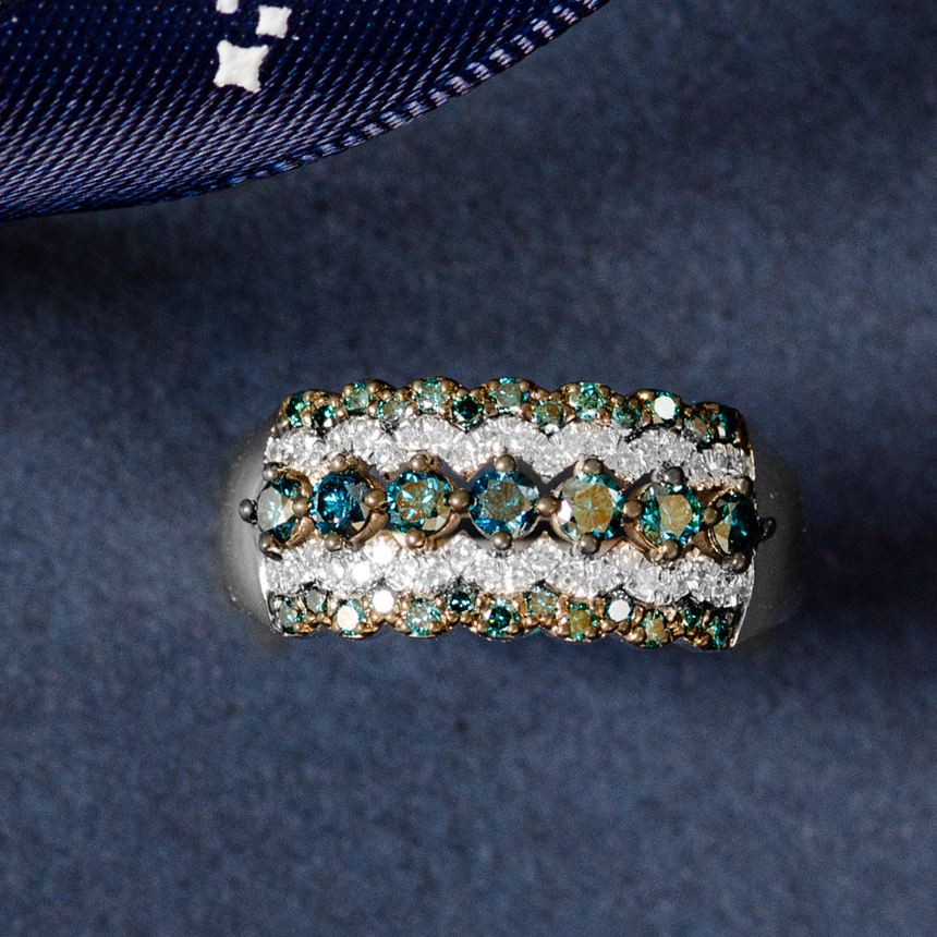 Blue Diamond Engagement Ring with SARATTI Logo