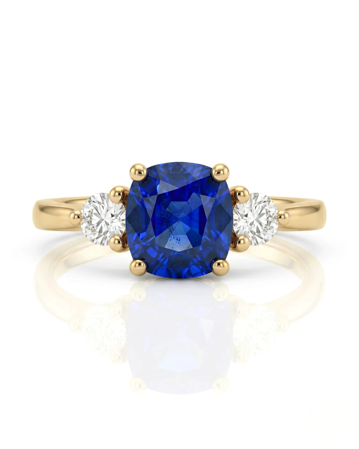 Blue cushion sapphire ring with natural diamond side stones in yellow gold | SARATTI