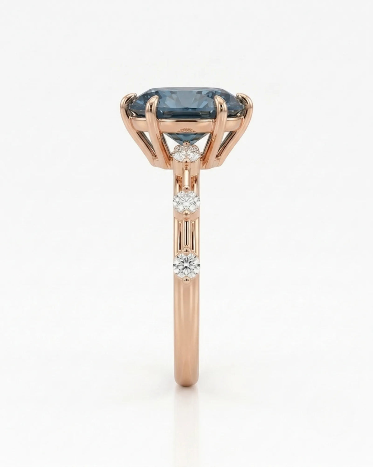 Blue moissanite ring with sculptural prong setting and romantic rose gold band | SARATTI