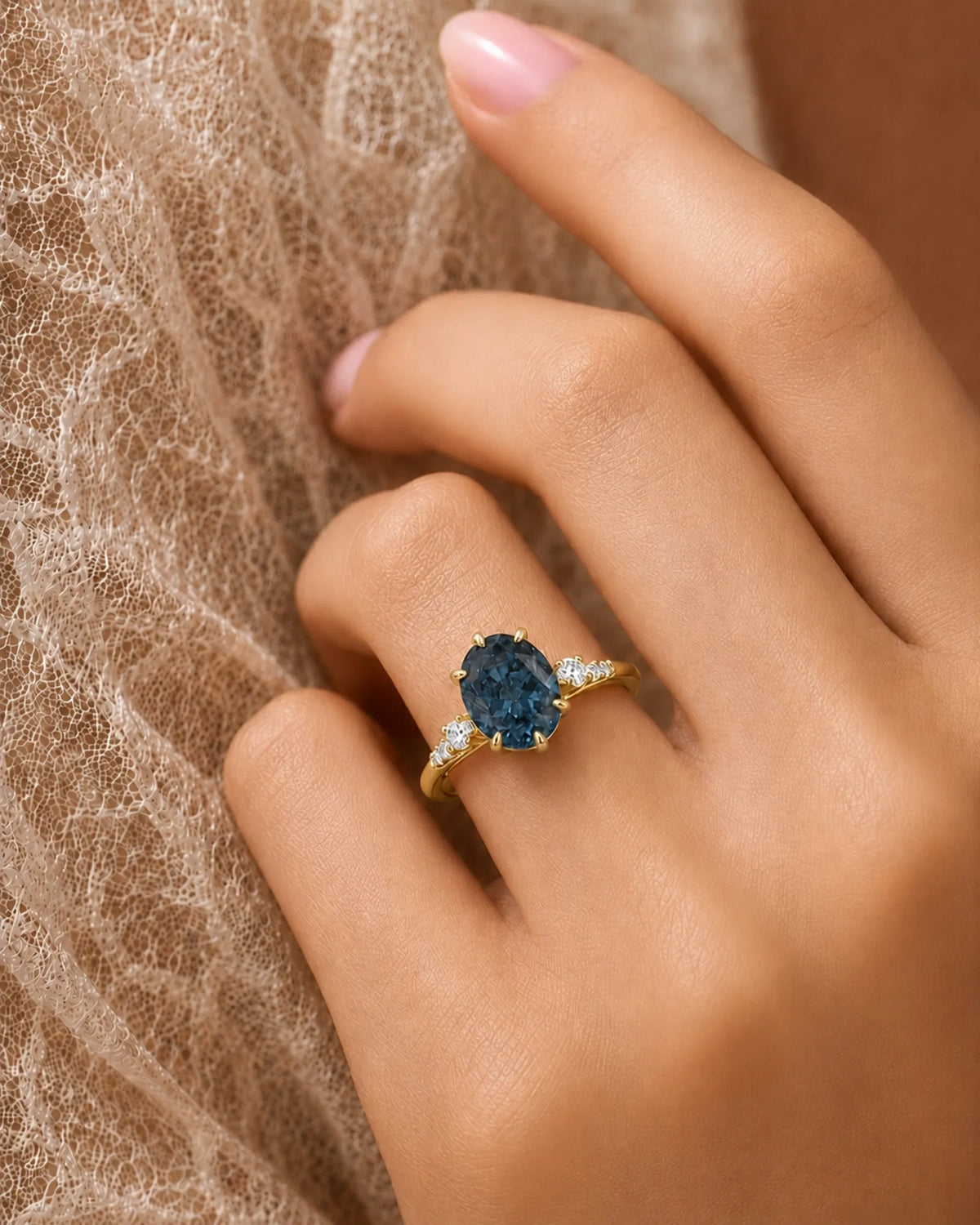Blue moissanite ring with sculptural prong setting and warm yellow gold band | SARATTI