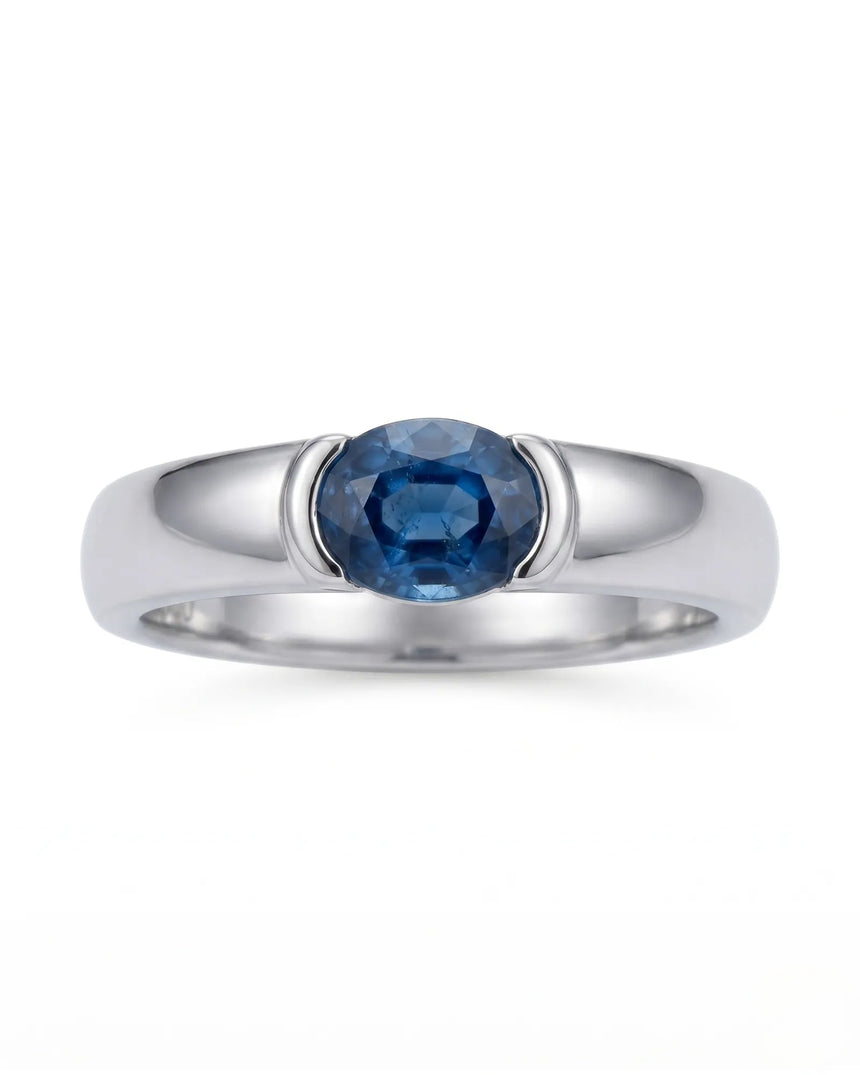 Blue oval sapphire ring with protective bezel design in 18K white gold | SARATTI