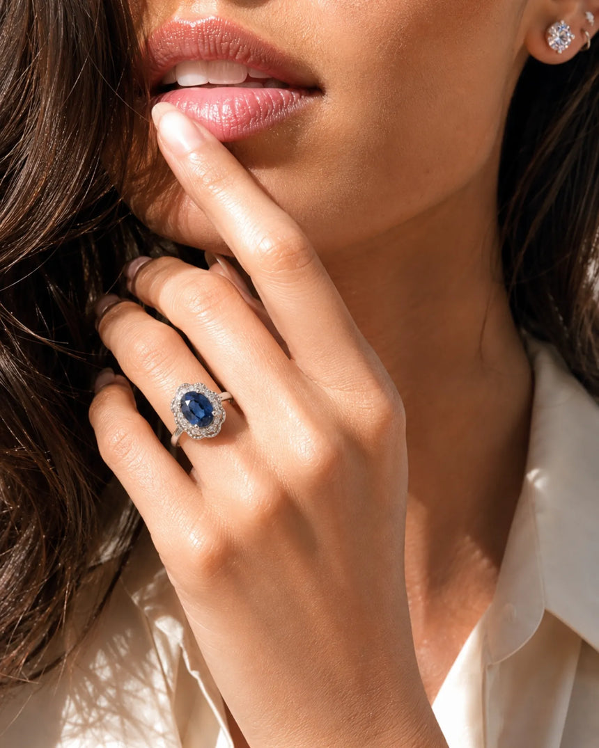 Blue oval sapphire ring with round natural diamonds in 18K white gold | SARATTI