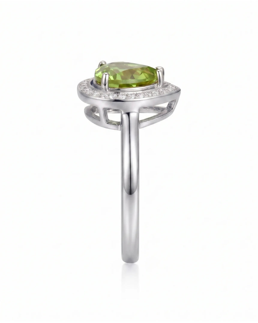 Bright green tourmaline ring with delicate diamond halo and elegant Platinum setting | SARATTI
