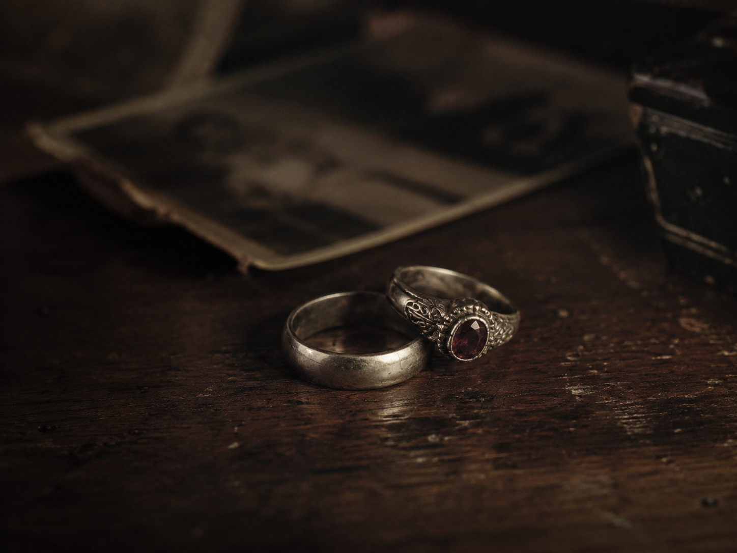 The two silver rings — full bleed, soft daylight, low contrast