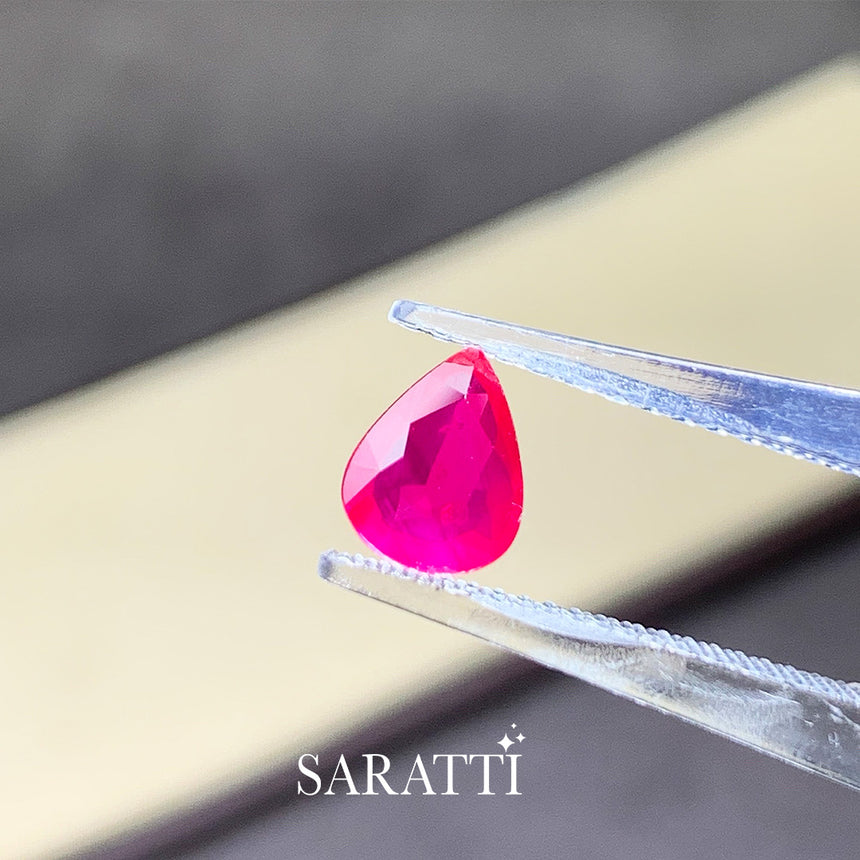 Close-up of 1.02 carat Unheated Natural ruby pear faceted | SARATTI