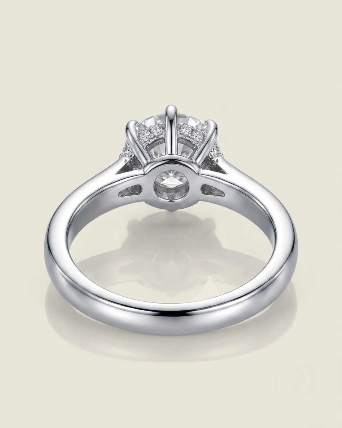 Colorless round moissanite framed by an eight-prong white gold flower-inspired crown | SARATTI