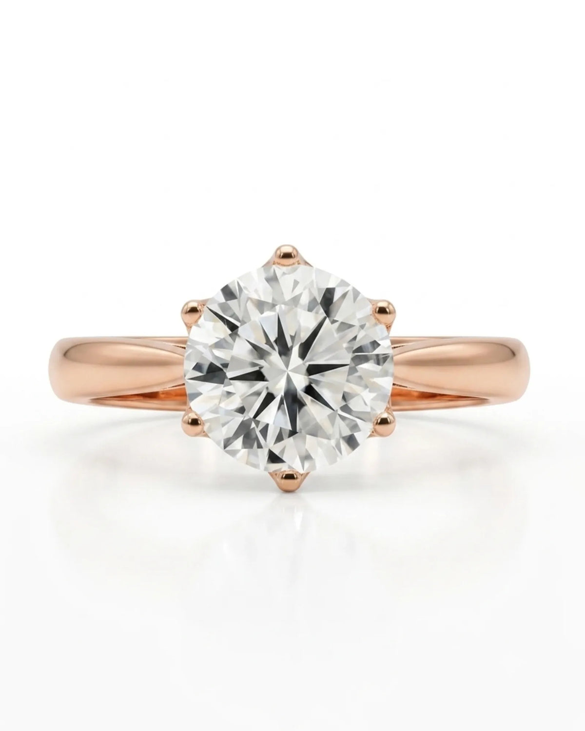 Colorless round moissanite solitaire ring with warm rose gold six-prong crown | SARATTI