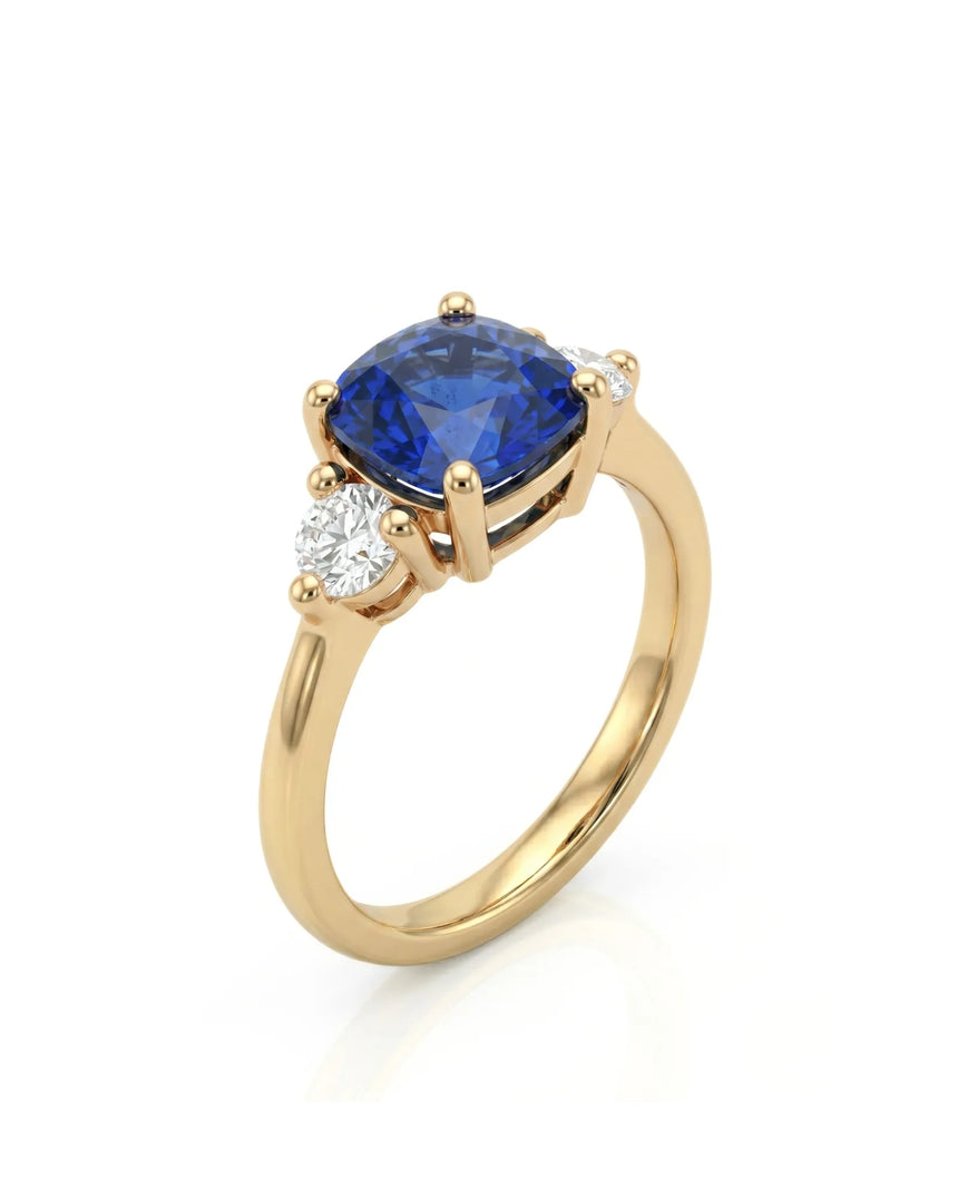 Cushion blue sapphire ring with two round diamonds in 18K yellow gold | SARATTI