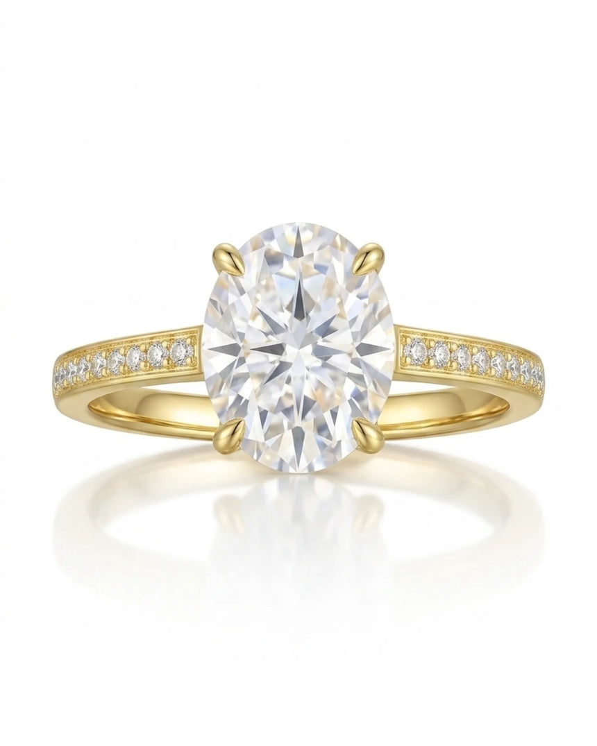 D color oval moissanite center framed by round accents in polished 18K yellow gold | SARATTI