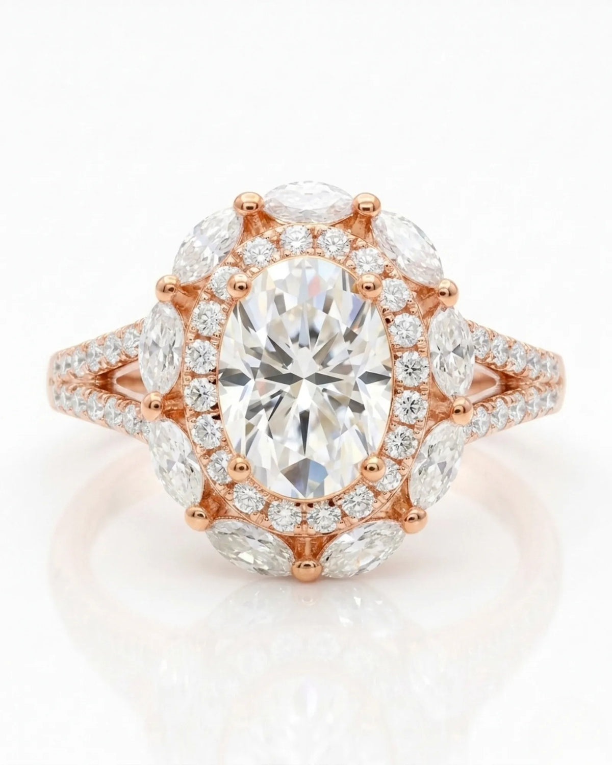 D color oval moissanite center framed by round and marquise stones in 18K rose gold | SARATTI