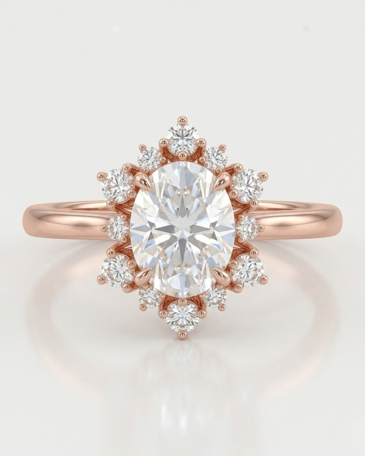 D color oval moissanite framed by round moissanite stones in polished 18K rose gold | SARATTI
