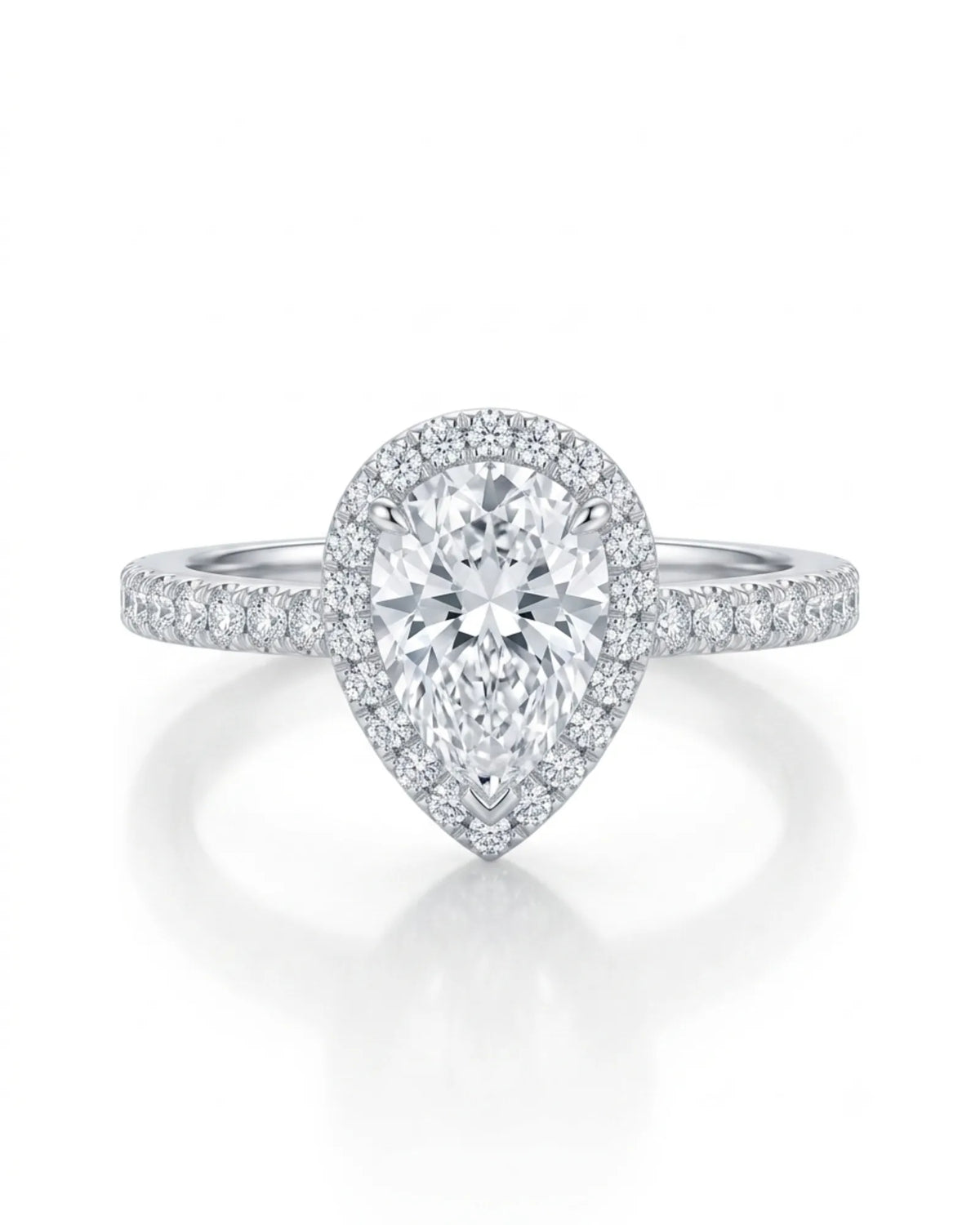 D color pear cut moissanite framed by round accents in polished 18K white gold | SARATTI