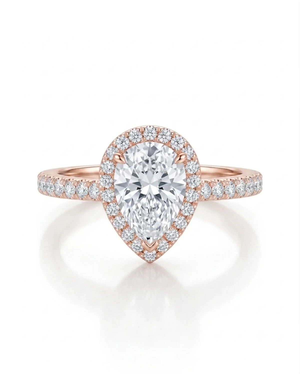 D color pear moissanite center framed by round accents in softly polished 18K rose gold | SARATTI