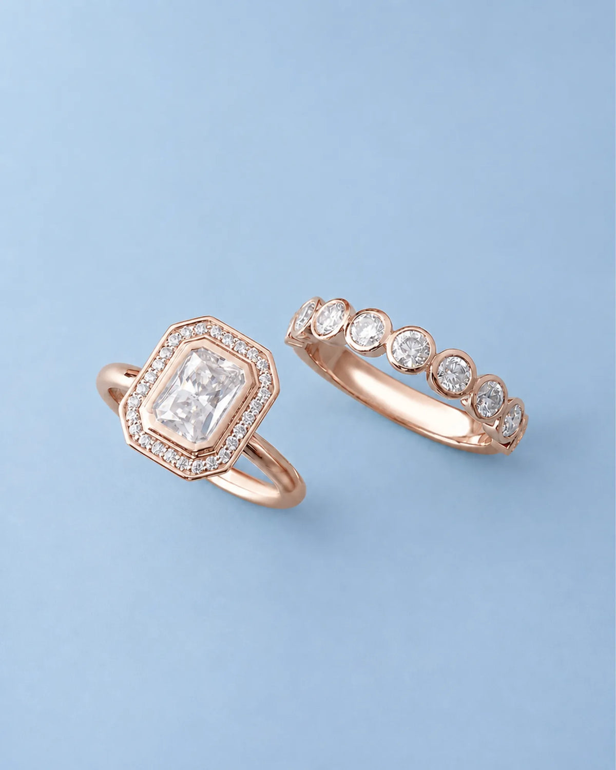 D color radiant moissanite center framed by round moissanite accents in polished 18K rose gold | SARATTI