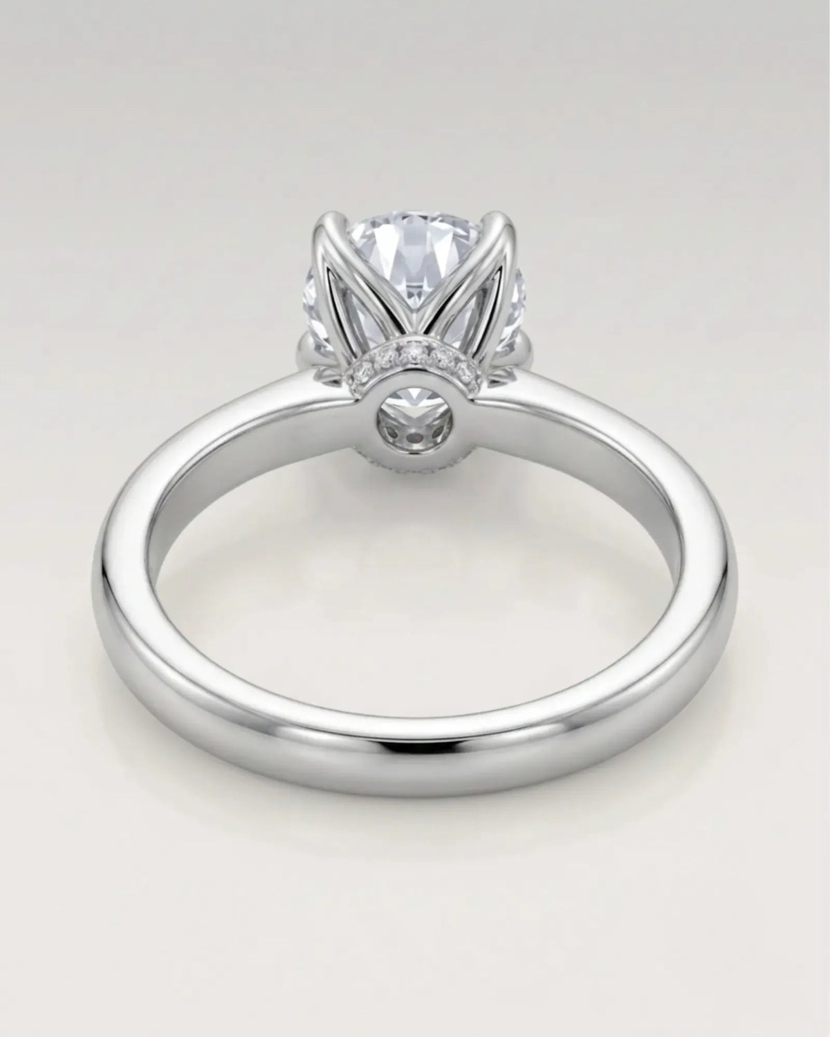 D color round moissanite center with discreet pavé accents in enduring platinum | SARATTI