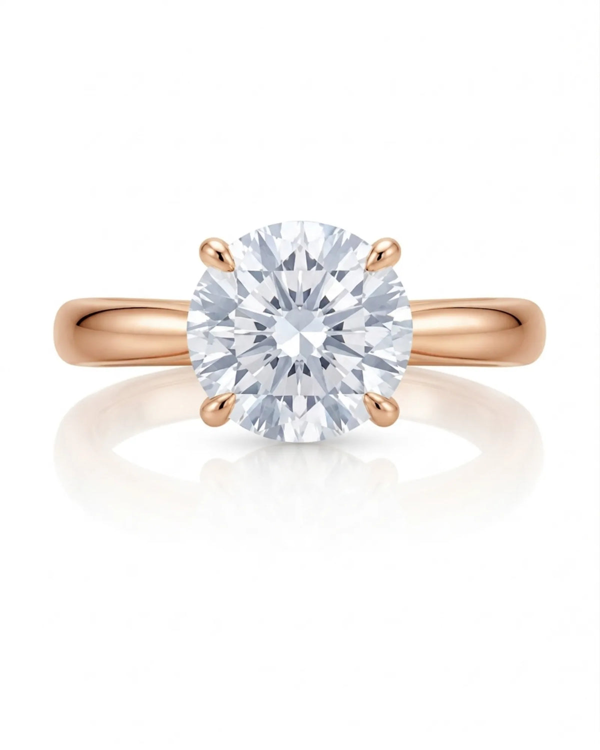 D color round moissanite center with discreet pavé accents in warm 18K rose gold | SARATTI