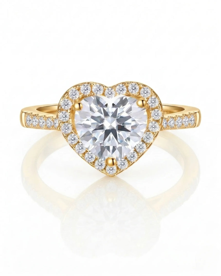 D colorless heart moissanite ring framed by round accent stones in 18K yellow gold | SARATTI