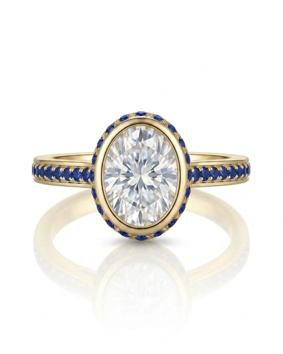 D colorless oval moissanite framed by vivid blue sapphires in polished 18K yellow gold | SARATTI