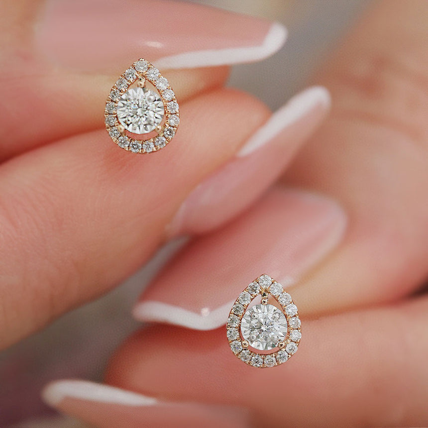 Petite Prong Set Tiny Diamond Halo Stud Earring in Model's Fingers | Saratti | Custom High and Fine Jewelry