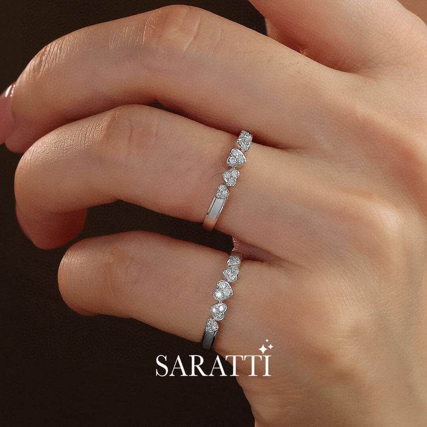 Model wears two 18 K White Gold Five Heart Diamond Eternity Wedding Bands | Saratti