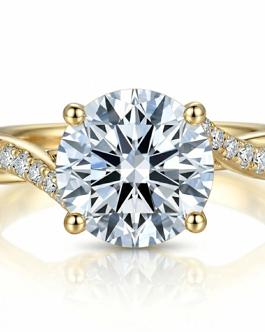 Elegant diamond engagement ring with pavé side diamonds and warm 18K yellow gold setting | SARATTI