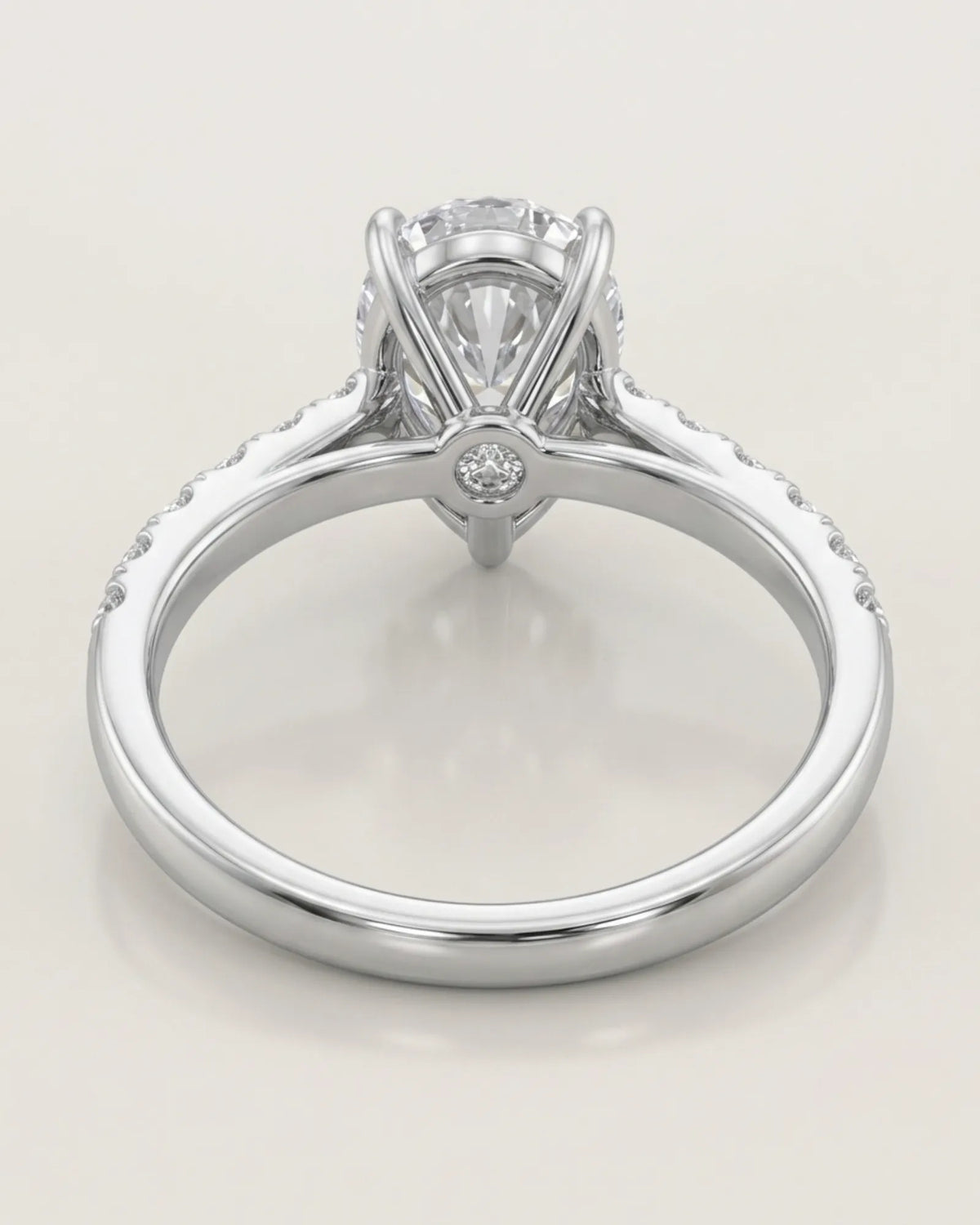 Elegant pear moissanite engagement ring with round side stones for a modern proposal in white gold | SARATTI