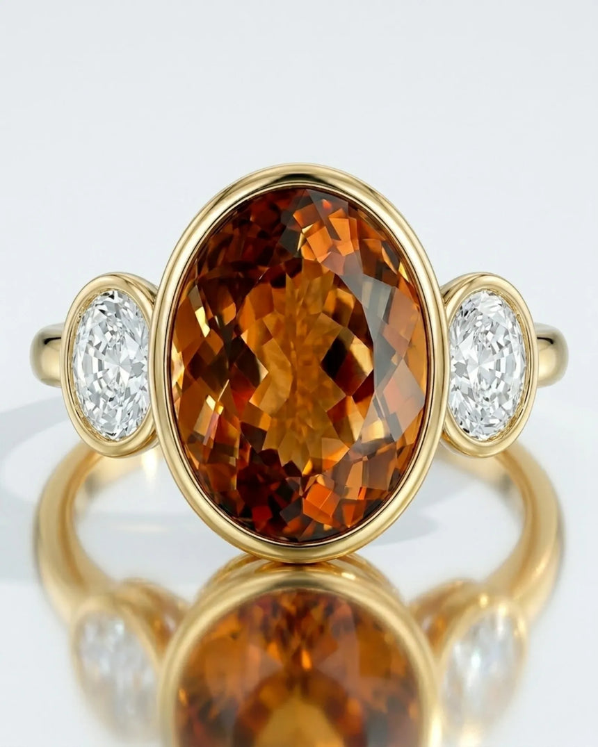 Elevated setting allows light to move through the center gemstone in yellow gold | SARATTI