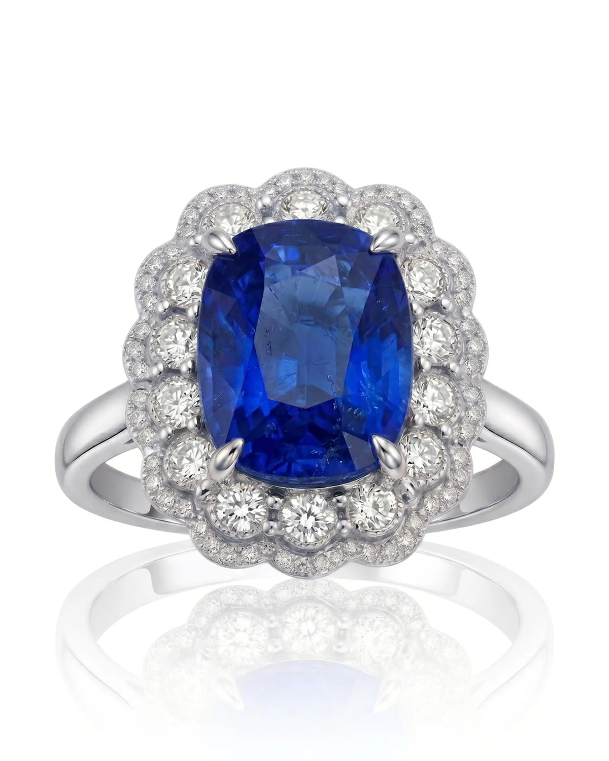 Elongated cushion natural sapphire ring framed by round diamonds in 18K white gold | SARATTI