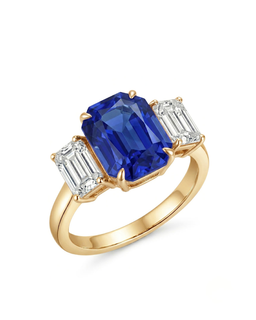 Emerald cut blue sapphire ring with emerald cut diamond accents in 18K yellow gold | SARATTI