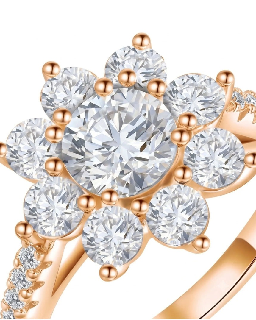 Floral moissanite ring with round center and eight petal-like accents in 18K rose gold | SARATTI