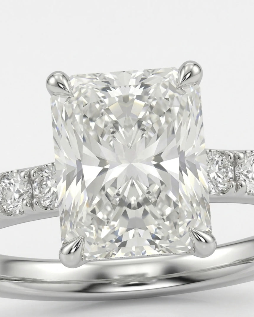 Four-prong radiant diamond ring with round pavé shoulder stones and an 18K white gold band - SARATTI