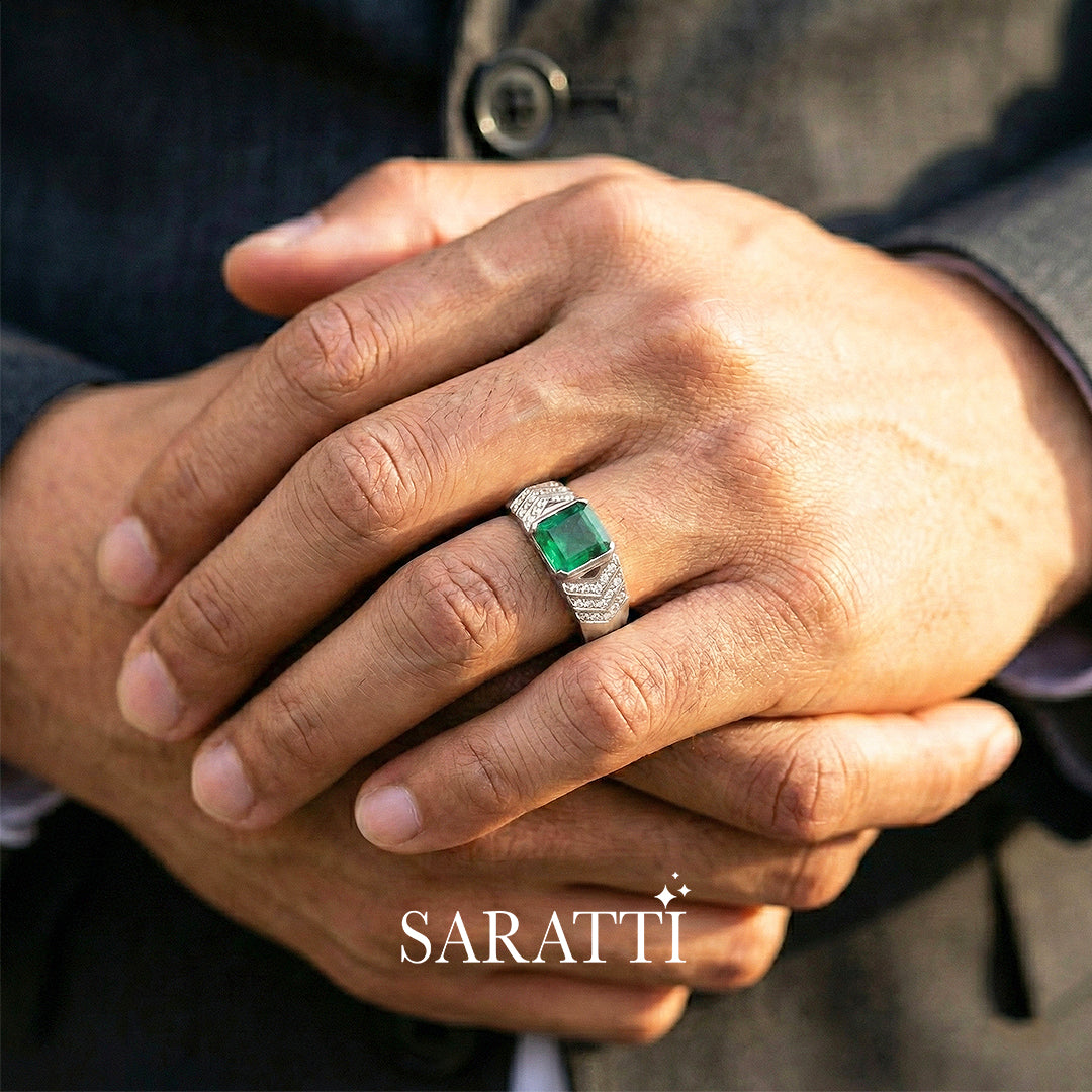 Mens emerald ring emerald cut center stone detail in 18K white gold | SARATTI