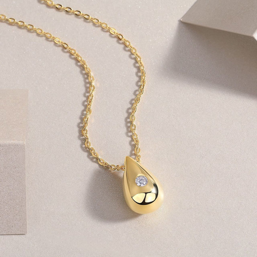 Golden Dawn: Luminous Moissanite Vermeil Teardrop Pendant