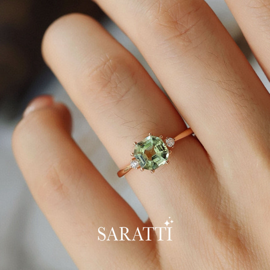 Close up Shot of the Yellow Gold Electric Dreams Three Stone Green Tourmaline Ring on model's finger | Saratti Fine Jewelry