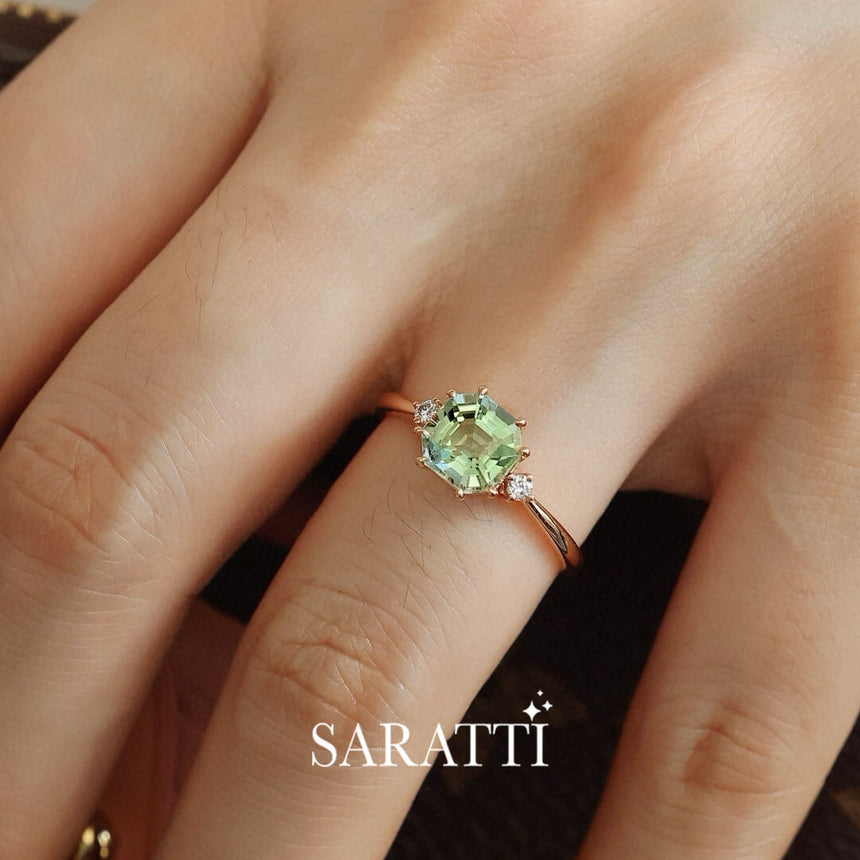Centre Stone Perspective | Model Sports the Yellow Gold Electric Dreams Three Stone Green Tourmaline Ring | Saratti Fine Jewelry